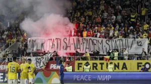 epa10008635 Fans of Romania light flares during the UEFA Nations League soccer match between Romania and Finland in Bucharest, Romania, 11 June 2022. EPA/ROBERT GHEMENT