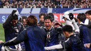 Soccer Football - World Cup - AFC Qualifiers - Third Round - Group C - Japan v Bahrain - Saitama Stadium, Saitama, Japan - March 20, 2025 Japan coach Hajime Moriyasu celebrates after qualifying for the 2026 World Cup REUTERS/Kim Kyung-Hoon