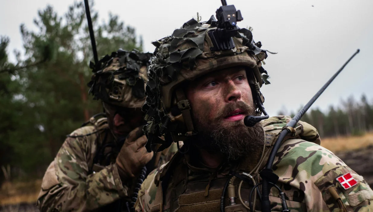 Royal Danish Army soldiers communicate with a radio during exercise Resolute Warrior 24 at Adaži, Latvia on 6 November 2024./NATO/