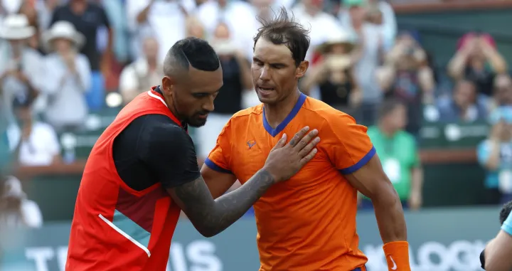 epa09832734 Rafael Nadal of Spain (R) greets Nick Kyrgios of Australia at the net after their match during the BNP Paribas Open tennis tournament at the Indian Wells Tennis Garden in Indian Wells, California, USA, 17 March 2022. Nadal defeated Kyrgios in two tie-break sets, 7-6 (0), 6-4. EPA/JOHN G MABANGLO