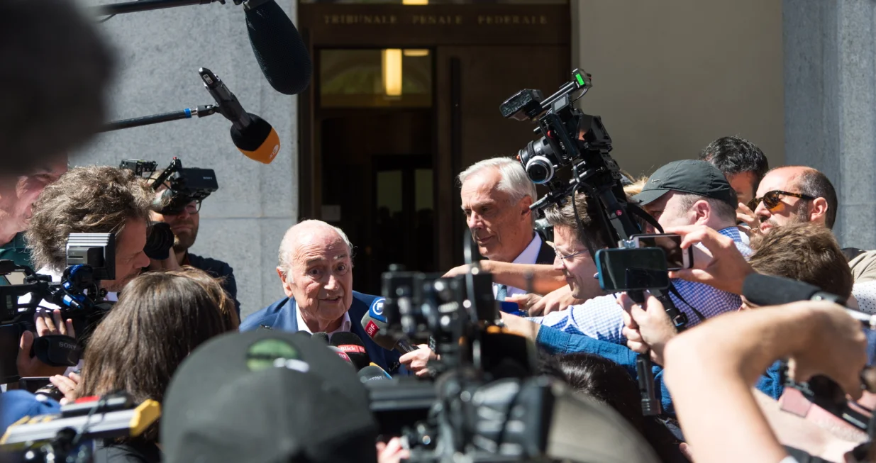 epa10058876 The former FIFA President, Joseph Blatter (C) surrounded by media representatives, speaks to the press in front of the Swiss Federal Criminal Court after the verdict has been announced, in Bellinzona, Switzerland, 08 July 2022. The trial ended with an acquittal. Former FIFA President Joseph Blatter and former UEFA president Michel Platini, stood trial before the Federal Criminal Court over a suspicious two-million payment. The Federal Prosecutor's Office accused them of fraud. The defense spoke of a conspiracy. EPA/ALESSANDRO CRINARI