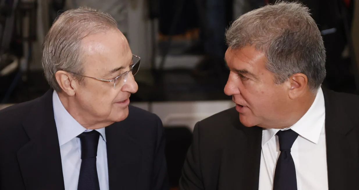epa10368134 The President of Real Madrid and construction activities and services global company ACS, Florentino Perez (L), speaks with the President of FC Barcelona, Joan Laporta, during a briefing breakfast organized by the New Economy Forum under the title 'Super League in the future of European soccer', in Madrid, Spain, 16 December 2022. EU Advocate General Athanasios Rantos proposed on 15 December that the European Court of Justice should back rules allowing UEFA and FIFA to block Super League, a breakaway competition supported by Real Madrid, FC Barcelona and Juventus Turin. EPA/MARISCAL