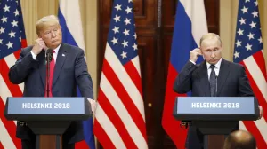 epa08939637 (FILE) US President Donald J. Trump (L) and Russian President Vladimir Putin (R) adjust their earpiece plugs during a joint press conference following their summit talks at the Presidential Palace in Helsinki, Finland, 16 July 2018. The presidency of Donald Trump, which records two presidential impeachments, will end at noon on 20 January 2021. EPA/ANATOLY MALTSEV/Anatoly Maltsev