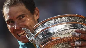 epa09997875 Rafael Nadal of Spain poses with the trophy La Coupe des Mousquetaires after winning against Casper Ruud of Norway in their Men's Singles final match during the French Open tennis tournament at Roland ​Garros in Paris, France, 05 June 2022. EPA/MARTIN DIVISEK