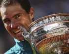 epa09997875 Rafael Nadal of Spain poses with the trophy La Coupe des Mousquetaires after winning against Casper Ruud of Norway in their Men's Singles final match during the French Open tennis tournament at Roland ​Garros in Paris, France, 05 June 2022. EPA/MARTIN DIVISEK