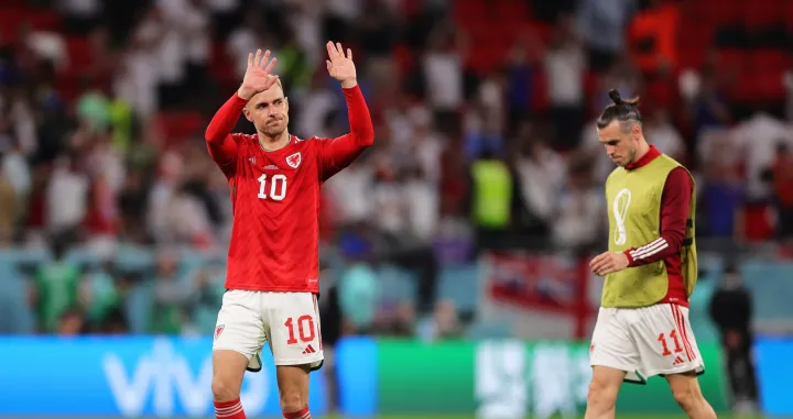 epa10337513 Welsh players Aaron Ramsey (L) and Gareth Bale (R) react after the FIFA World Cup 2022 group B soccer match between Wales and England at Ahmad bin Ali Stadium in Doha, Qatar, 29 November 2022. EPA/Friedemann Vogel