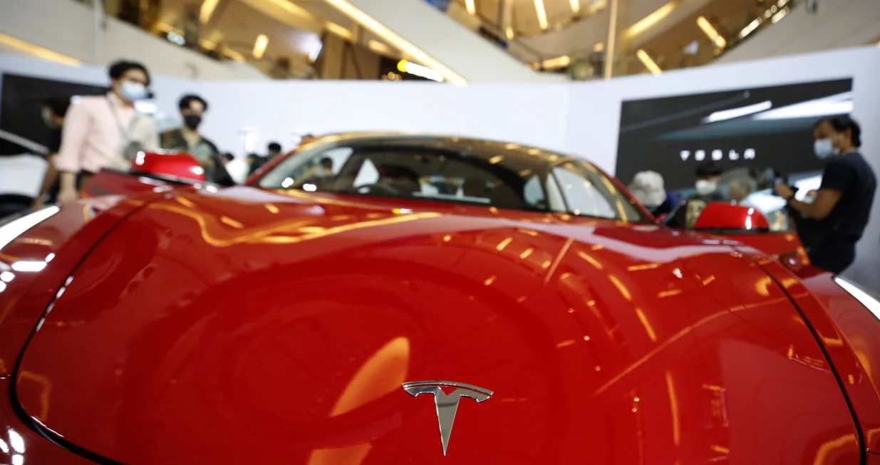 epa10353303 Tesla car logo is display on Tesla Model 3, during Tesla official launching event in Thailand, in Bangkok, Thailand, 07 December 2022. Tesla, after years of market research and preparations, officially launh the Model 3 and Model Y electric vehicles for the Thailand market, with at least up to 10 Supercharging stations by 2023 in Thailand. EPA/NARONG SANGNAK/Narong Sangnak