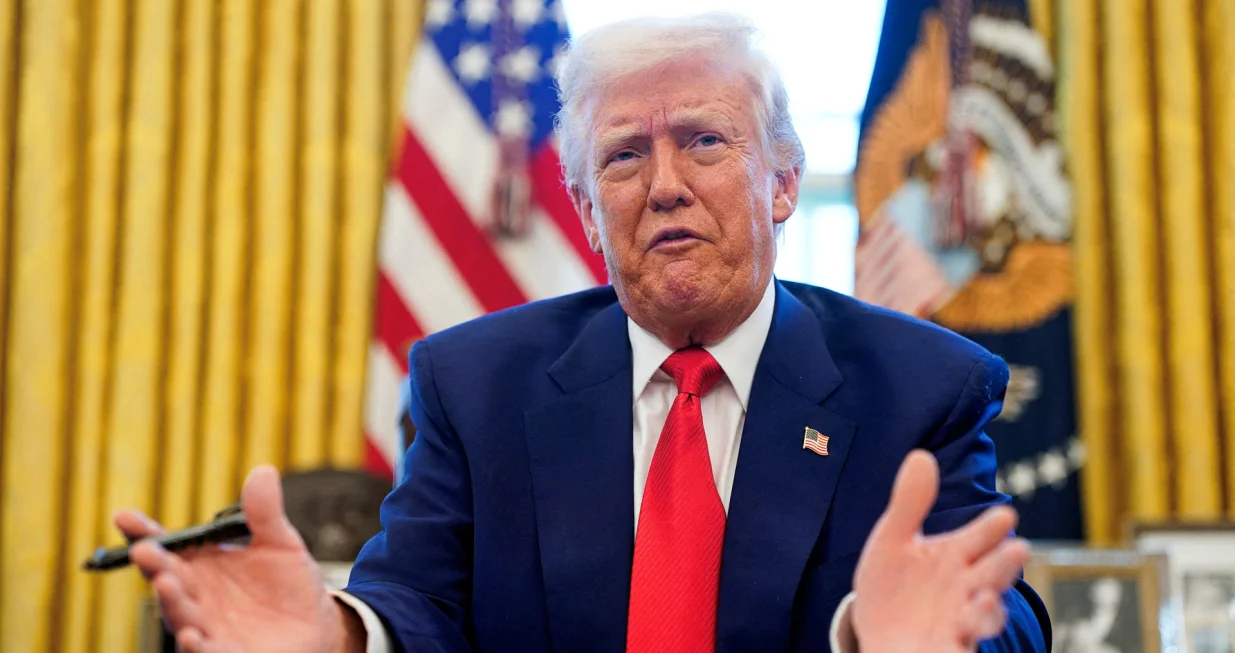 FILE PHOTO: U.S. President Donald Trump speaks, as he signs executive orders and proclamations in the Oval Office at the White House in Washington, D.C., U.S., April 9, 2025. REUTERS/Nathan Howard/File Photo/Nathan Howard
