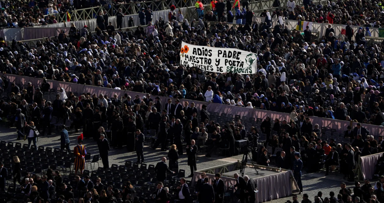 People hold a banner that says "Goodbye Father, Teacher and Poet", ahead of the funeral Mass of Pope Francis in St. Peter's Square at the Vatican, April 26, 2025. REUTERS/Nathan Howard/Nathan Howard