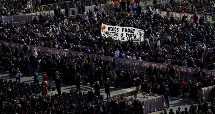 People hold a banner that says "Goodbye Father, Teacher and Poet", ahead of the funeral Mass of Pope Francis in St. Peter's Square at the Vatican, April 26, 2025. REUTERS/Nathan Howard/Nathan Howard