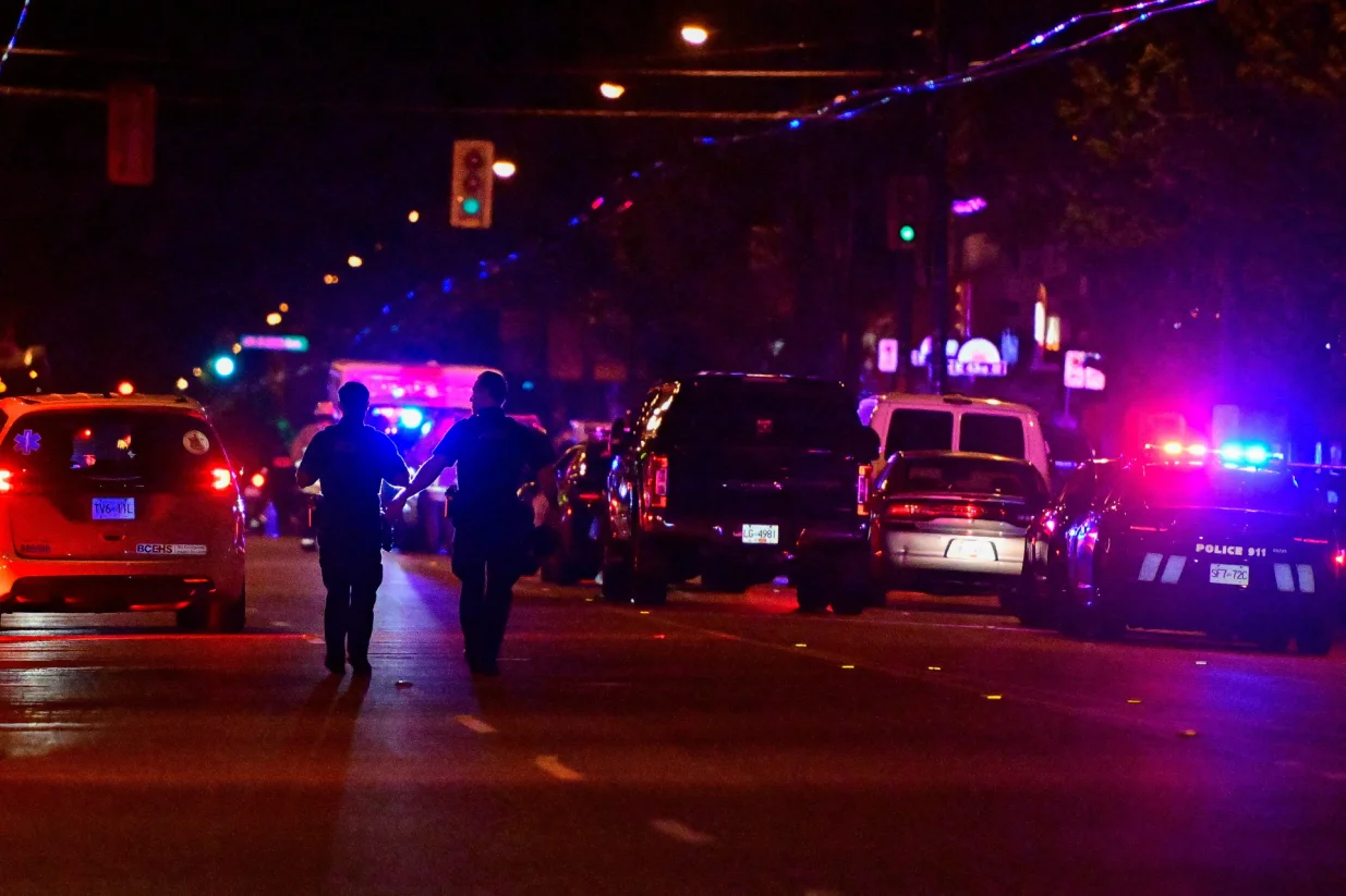 Police officers walk on Fraser street, near the site of the Lapu Lapu day block party where a vehicle drove into a crowd killing several people in Vancouver, British Columbia, Canada April 26, 2025. REUTERS/Jennifer Gauthier/Jennifer Gauthier