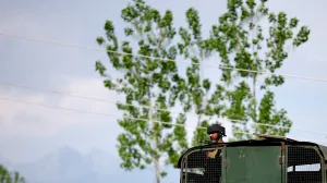 An Indian Army soldier looks out from an armoured vehicle on a highway leading to South Kashmir's Pahalgam, following a suspected militant attack, in Marhama village, in Kashmir, April 23, 2025. REUTERS/Adnan Abidi  TPX IMAGES OF THE DAY/Adnan Abidi