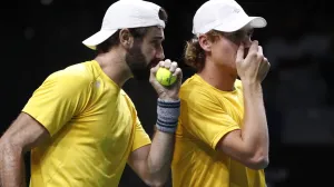 epa10328657 Australia's Jordan Thompson (L) and Max Purcell (R) in action against Croatia's Nikola Mektic and Mate Pavic during their match in the Davis Cup semi final between Croatia and Australia in Malaga, Spain, 25 November 2022. EPA/Jorge Zapata