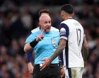 Soccer Football - Europa League - Quarter Final - First Leg - Tottenham Hotspur v Eintracht Frankfurt - Tottenham Hotspur Stadium, London, Britain - April 10, 2025 Tottenham Hotspur's Cristian Romero remonstrate with referee Szymon Marciniak REUTERS/David Klein