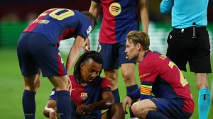 Soccer Football - Champions League - Semi Final - First Leg - FC Barcelona v Inter Milan - Estadi Olimpic Lluis Companys, Barcelona, Spain - April 30, 2025 FC Barcelona's Jules Kounde reacts after sustaining an injury REUTERS/Albert Gea