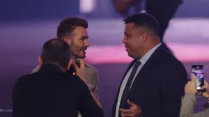 epa10368868 Former English international David Beckham (L) talks with his former Real Madrid teammate, former Brazilian international and 2002 World Cup winner Ronaldo (R) during the Qatar Fashion United by CR Runway fashion show at the 974 Stadium in Doha, Qatar, 16 December 2022. EPA/MARTIN DIVISEK