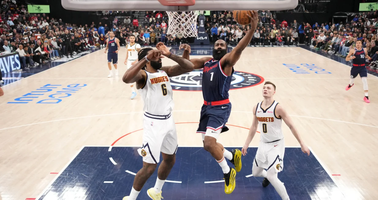 May 1, 2025; Inglewood, California, USA; LA Clippers guard James Harden (1) shoots the ball against Denver Nuggets center DeAndre Jordan (6) and guard Christian Braun (0) in the first half during game six of first round for the 2025 NBA Playoffs at Intuit Dome. Mandatory Credit: Kirby Lee-Imagn Images