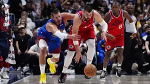 May 3, 2025; Denver, Colorado, USA; LA Clippers center Ivica Zubac (40) steals the ball away from Denver Nuggets center Nikola Jokic (15) in the second quarter during game seven of first round for the 2025 NBA Playoffs at Ball Arena. Mandatory Credit: Ron Chenoy-Imagn Images