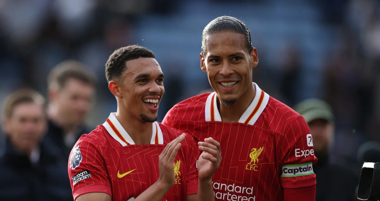Soccer Football - Premier League - Leicester City v Liverpool - King Power Stadium, Leicester, Britain - April 20, 2025 Liverpool's Virgil van Dijk and Liverpool's Trent Alexander-Arnold celebrate after the match REUTERS/Phil Noble EDITORIAL USE ONLY. NO USE WITH UNAUTHORIZED AUDIO, VIDEO, DATA, FIXTURE LISTS, CLUB/LEAGUE LOGOS OR 'LIVE' SERVICES. ONLINE IN-MATCH USE LIMITED TO 120 IMAGES, NO VIDEO EMULATION. NO USE IN BETTING, GAMES OR SINGLE CLUB/LEAGUE/PLAYER PUBLICATIONS. PLEASE CONTACT YOUR ACCOUNT REPRESENTATIVE FOR FURTHER DETAILS..