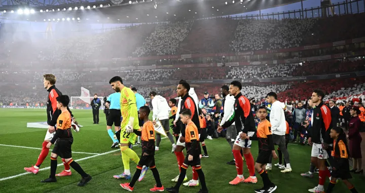 Soccer Football - Champions League - Quarter Final - First Leg - Arsenal v Real Madrid - Emirates Stadium, London, Britain - April 8, 2025 Arsenal's Martin Odegaard, David Raya, Myles Lewis-Skelly and William Saliba walk out onto the pitch before the match REUTERS/Dylan Martinez