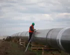 FILE PHOTO: A worker is seen next to a pipe at a construction site on the extension of Russia's TurkStream gas pipeline after a visit of Serbia's President Aleksandar Vucic and Bulgaria's Prime Minister Boyko Borissov, in Letnitsa, Bulgaria, June 1, 2020. REUTERS/ Stoyan Nenov/File Photo/Stoyan Nenov