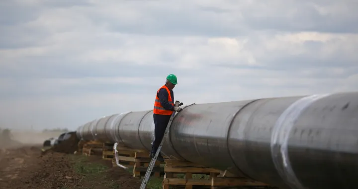 FILE PHOTO: A worker is seen next to a pipe at a construction site on the extension of Russia's TurkStream gas pipeline after a visit of Serbia's President Aleksandar Vucic and Bulgaria's Prime Minister Boyko Borissov, in Letnitsa, Bulgaria, June 1, 2020. REUTERS/ Stoyan Nenov/File Photo/Stoyan Nenov