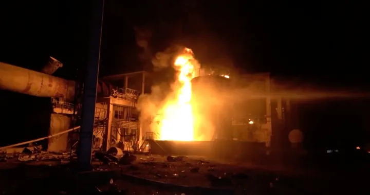 Water canon is being used on fire, as huge fires erupted at a cement factory in Yemen after the Israeli military said it carried out airstrikes against Hodeidah Port and its vicinity, a day after the Iran-aligned Houthis fired a missile that struck near Israel's main airport, at Bajil District, Hodeidah Governate, Yemen, May 5, 2025, in this screengrab obtained from a handout video. AL-MASIRAH TV/Handout via REUTERS THIS IMAGE HAS BEEN SUPPLIED BY A THIRD PARTY NO RESALES. NO ARCHIVES./Al-masirah Tv