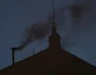 Black smoke rises from the chimney on the Sistine Chapel, indicating no decision has been made to elect a new pope, at the Vatican, May 7, 2025. REUTERS/Hannah McKay/Hannah Mckay