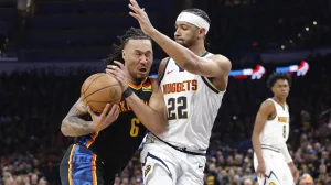 May 7, 2025; Oklahoma City, Oklahoma, USA;Oklahoma City Thunder forward Jaylin Williams (6) drives as Denver Nuggets forward Zeke Nnaji (22) defends in the second half during game two of the second round for the 2025 NBA Playoffs at Paycom Center. Mandatory Credit: Alonzo Adams-Imagn Images