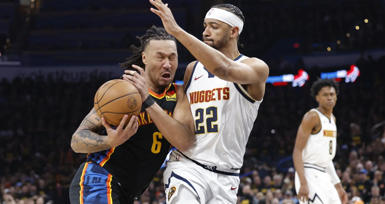 May 7, 2025; Oklahoma City, Oklahoma, USA;Oklahoma City Thunder forward Jaylin Williams (6) drives as Denver Nuggets forward Zeke Nnaji (22) defends in the second half during game two of the second round for the 2025 NBA Playoffs at Paycom Center. Mandatory Credit: Alonzo Adams-Imagn Images