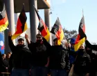 FILE PHOTO: Supporters of the Alternative for Germany party (AfD) wave flags as they take part in an AfD campaign rally in Hohenschoenhausen, Berlin, Germany, February 22, 2025. REUTERS/Christian Mang/File Photo/Christian Mang