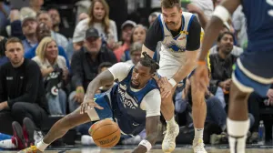 May 8, 2025; Minneapolis, Minnesota, USA; Minnesota Timberwolves center Naz Reid (11) and Golden State Warriors guard Pat Spencer (61) dive for a loose ball in the second half during game two of the second round for the 2025 NBA Playoffs at Target Center. Mandatory Credit: Jesse Johnson-Imagn Images