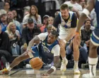 May 8, 2025; Minneapolis, Minnesota, USA; Minnesota Timberwolves center Naz Reid (11) and Golden State Warriors guard Pat Spencer (61) dive for a loose ball in the second half during game two of the second round for the 2025 NBA Playoffs at Target Center. Mandatory Credit: Jesse Johnson-Imagn Images