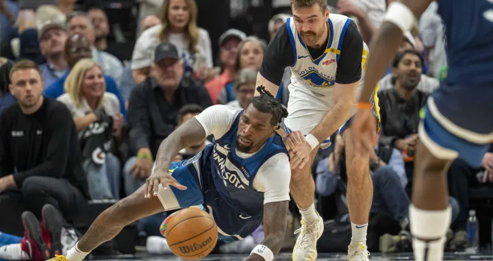 May 8, 2025; Minneapolis, Minnesota, USA; Minnesota Timberwolves center Naz Reid (11) and Golden State Warriors guard Pat Spencer (61) dive for a loose ball in the second half during game two of the second round for the 2025 NBA Playoffs at Target Center. Mandatory Credit: Jesse Johnson-Imagn Images