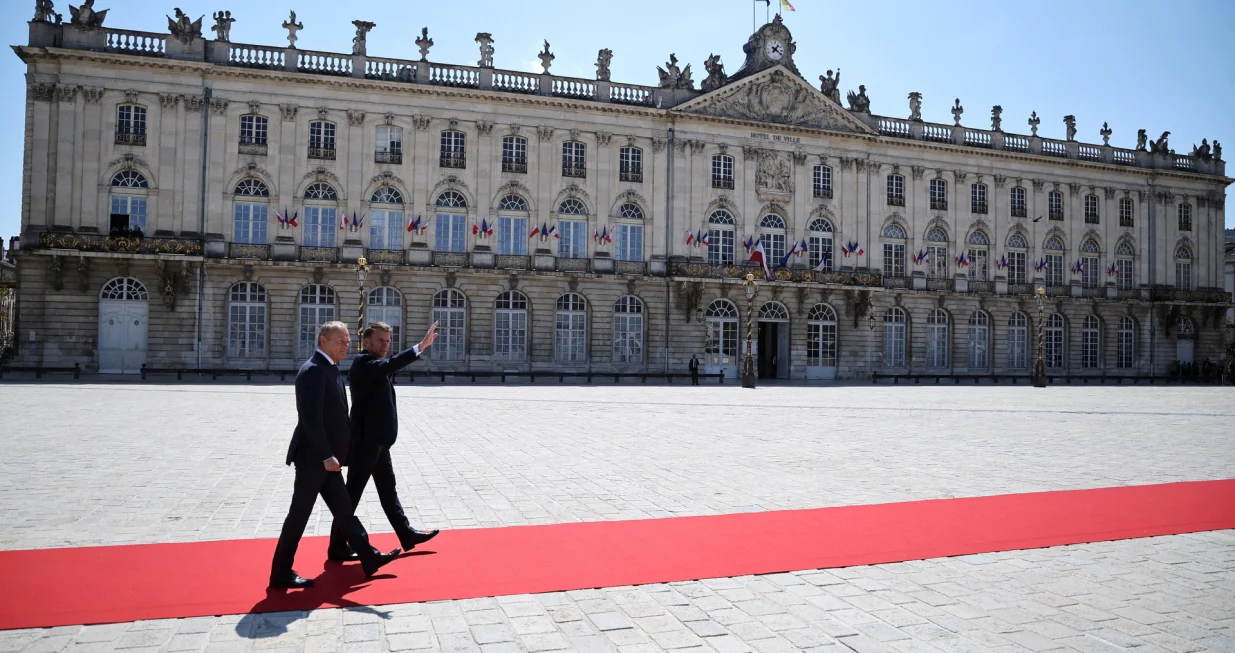 French President Emmanuel Macron welcomes Polish Prime Minister Donald Tusk on Stanislas square in Nancy, France, May 9, 2025. Macron and Tusk meet in Nancy as part of a summit to sign a treaty of friendship and enhanced cooperation between France and Poland. Christophe Petit Tesson/Pool via REUTERS  TPX IMAGES OF THE DAY/Christophe Petit Tesson
