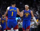 May 9, 2025; Denver, Colorado, USA; Denver Nuggets forward Aaron Gordon (32) celebrates his three point score with forward Michael Porter Jr. (1) in the fourth quarter against the Oklahoma City Thunder during game three of the second round for the 2025 NBA Playoffs at Ball Arena. Mandatory Credit: Ron Chenoy-Imagn Images
