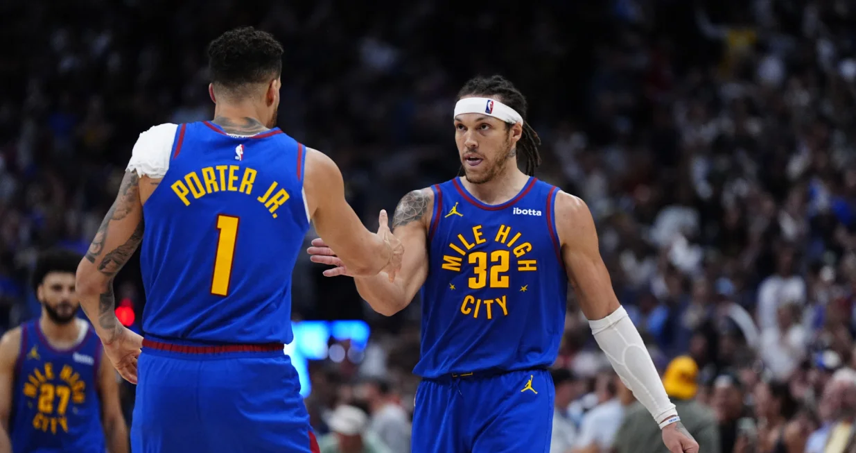 May 9, 2025; Denver, Colorado, USA; Denver Nuggets forward Aaron Gordon (32) celebrates his three point score with forward Michael Porter Jr. (1) in the fourth quarter against the Oklahoma City Thunder during game three of the second round for the 2025 NBA Playoffs at Ball Arena. Mandatory Credit: Ron Chenoy-Imagn Images