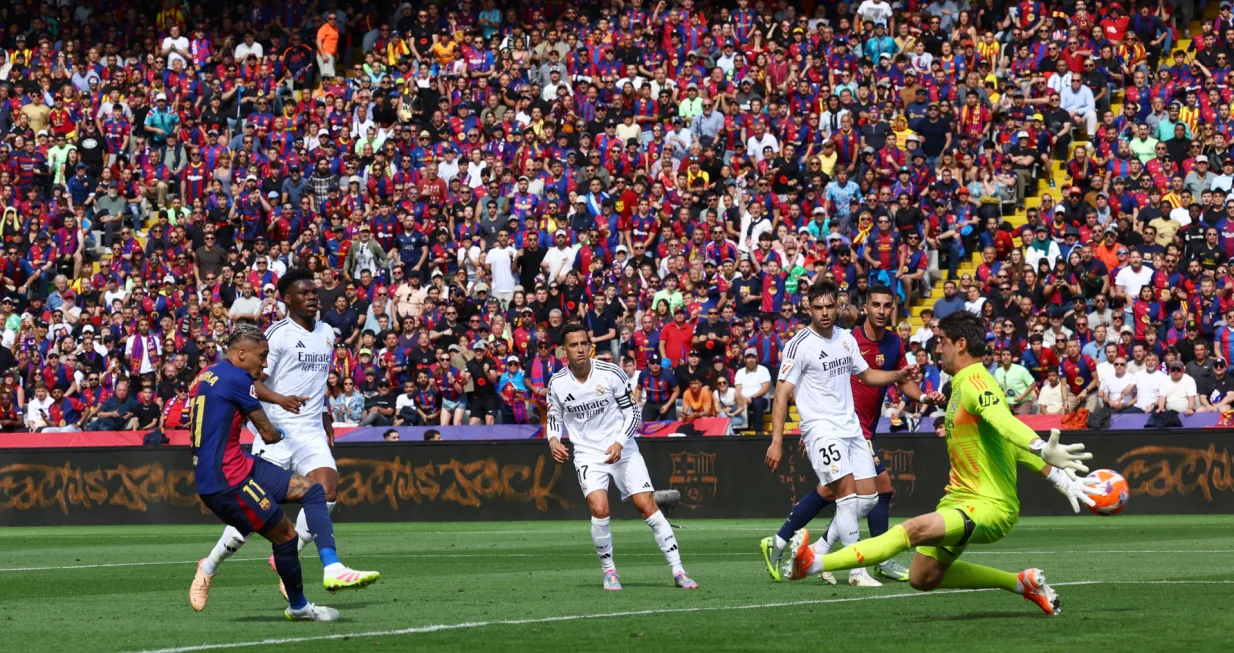 Soccer Football - LaLiga - FC Barcelona v Real Madrid - Estadi Olimpic Lluis Companys, Barcelona, Spain - May 11, 2025 FC Barcelona's Raphinha scores their fourth goal REUTERS/Albert Gea