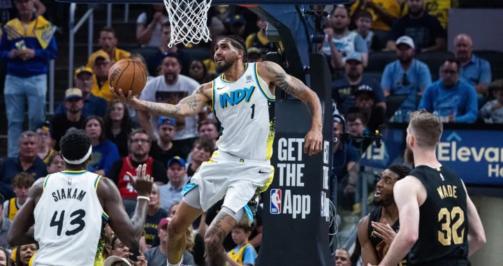 May 11, 2025; Indianapolis, Indiana, USA; Indiana Pacers forward Obi Toppin (1) shoots the ball while Cleveland Cavaliers guard Donovan Mitchell (45) defends during game four of the second round for the 2025 NBA Playoffs at Gainbridge Fieldhouse. Mandatory Credit: Trevor Ruszkowski-Imagn Images