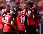 Soccer Football - Bundesliga - Bayer Leverkusen v Borussia Dortmund - BayArena, Leverkusen, Germany - May 11, 2025 Bayer Leverkusen's Jeremie Frimpong celebrates with teammates after scoring their first goal REUTERS/Thilo Schmuelgen DFL REGULATIONS PROHIBIT ANY USE OF PHOTOGRAPHS AS IMAGE SEQUENCES AND/OR QUASI-VIDEO.