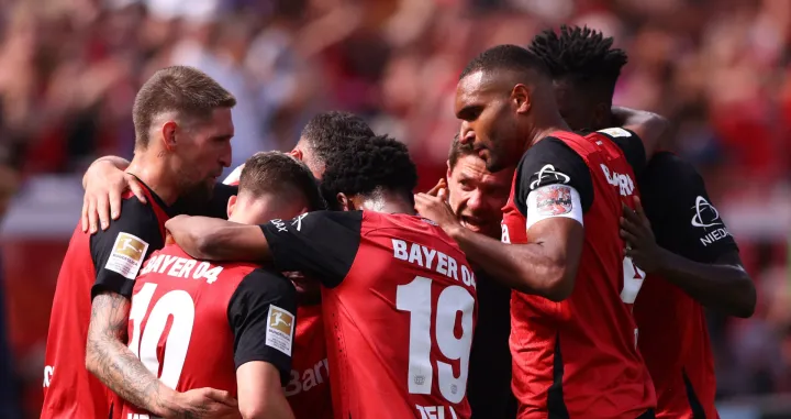 Soccer Football - Bundesliga - Bayer Leverkusen v Borussia Dortmund - BayArena, Leverkusen, Germany - May 11, 2025 Bayer Leverkusen's Jeremie Frimpong celebrates with teammates after scoring their first goal REUTERS/Thilo Schmuelgen DFL REGULATIONS PROHIBIT ANY USE OF PHOTOGRAPHS AS IMAGE SEQUENCES AND/OR QUASI-VIDEO.