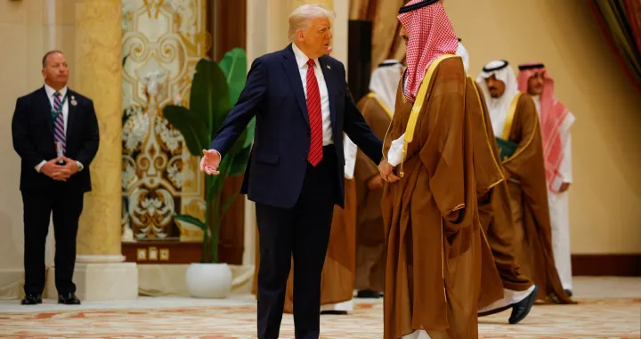 U.S. President Donald Trump gestures next to Saudi Crown Prince Mohammed Bin Salman as they attend a GCC summit in Riyadh, Saudi Arabia, May 14, 2025. REUTERS/Brian Snyder/Brian Snyder
