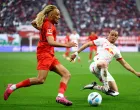 Soccer Football - Bundesliga - RB Leipzig v Bayern Munich - Red Bull Arena, Leipzig, Germany - May 3, 2025 Bayern Munich's Sacha Boey in action with RB Leipzig's Xavi Simons REUTERS/Lisi Niesner DFL REGULATIONS PROHIBIT ANY USE OF PHOTOGRAPHS AS IMAGE SEQUENCES AND/OR QUASI-VIDEO.