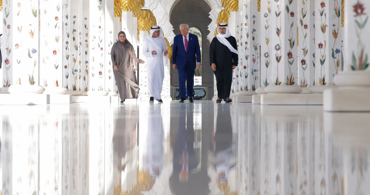 U.S. President Donald Trump is reflected off the floor as he walks with Yousif Al Obaidli, director of Sheikh Zayed Grand Mosque and Ameena Al Hammadi, acting director of the Culture and Knowledge Department while visiting the Sheikh Zayed Grand Mosque in Abu Dhabi, United Arab Emirates, May 15, 2025. REUTERS/Brian Snyder/Brian Snyder