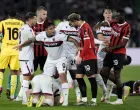 Soccer Football - Coppa Italia - Final - AC Milan v Bologna - Stadio Olimpico, Rome, Italy - May 14, 2025 Bologna's Santiago Castro remonstrates with AC Milan's Theo Hernandez as Bologna's Emil Holm reacts on the ground REUTERS/Matteo Ciambelli