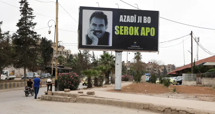 A sign depicts jailed Kurdish militant leader Abdullah Ocalan in Qamishli, Syria May 12, 2025. REUTERS/Orhan Qereman/Orhan Qereman