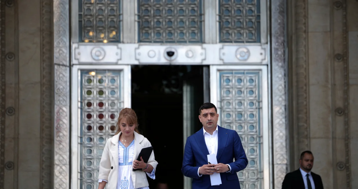Presidential candidate George Simion walks before speaking to the media in front of the parliament during Romania's second round of the presidential election, in Bucharest, Romania, May 18, 2025. REUTERS/Stoyan Nenov/Stoyan Nenov