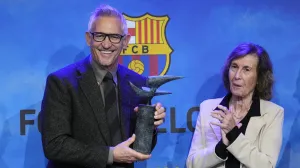 epa10262827 British former soccer player and current sports broadcaster Gary Lineker (L) receives the Vazquez Montalban Sports Journalism Award from the widow of Spanish journalist Manuel Vazquez Montalban, Anna Salles (R), in Barcelona, Spain, 24 October 2022. EPA/Alejandro Garcia