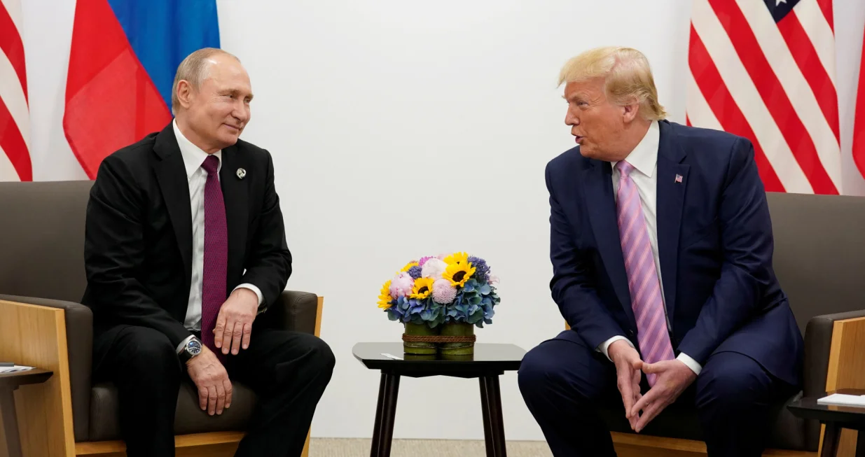 FILE PHOTO: Russia's President Vladimir Putin and U.S. President Donald Trump talk during a bilateral meeting at the G20 leaders summit in Osaka, Japan, June 28, 2019. REUTERS/Kevin Lamarque/File Photo/Kevin Lamarque
