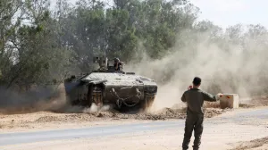 An Israeli armoured personnel carrier (APC) operates near the Israel-Gaza border, amid the ongoing conflict between Israel and Hamas, in Israel, May 19, 2025 REUTERS/Ronen Zvulun  TPX IMAGES OF THE DAY REFILE - CORRECTING TYPE OF VEHICLE FROM "AN ISRAELI TANK" TO "AN ISRAELI ARMOURED PERSONNEL CARRIER (APC)/Ronen Zvulun